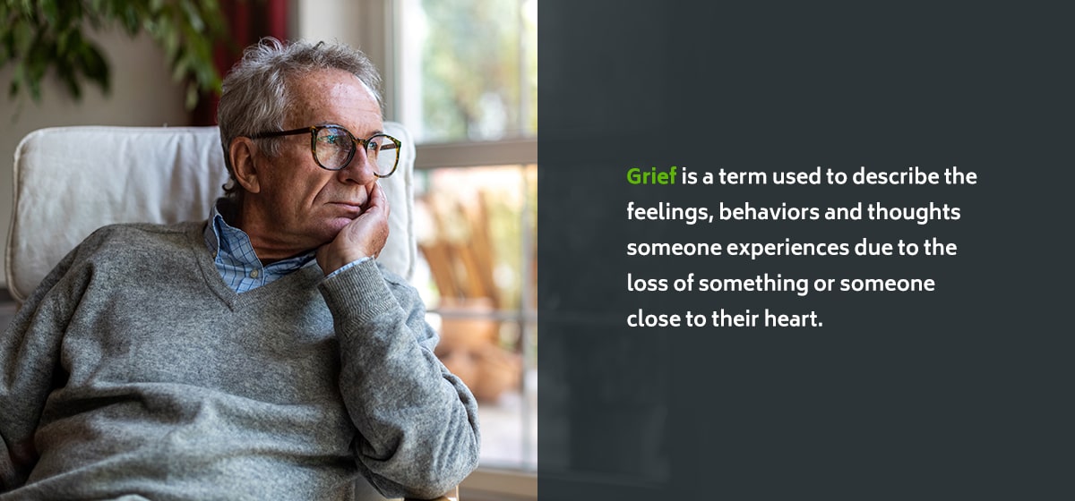 Older adult reflecting on grief, illustrating the definition of grief and its role in mental health treatment planning