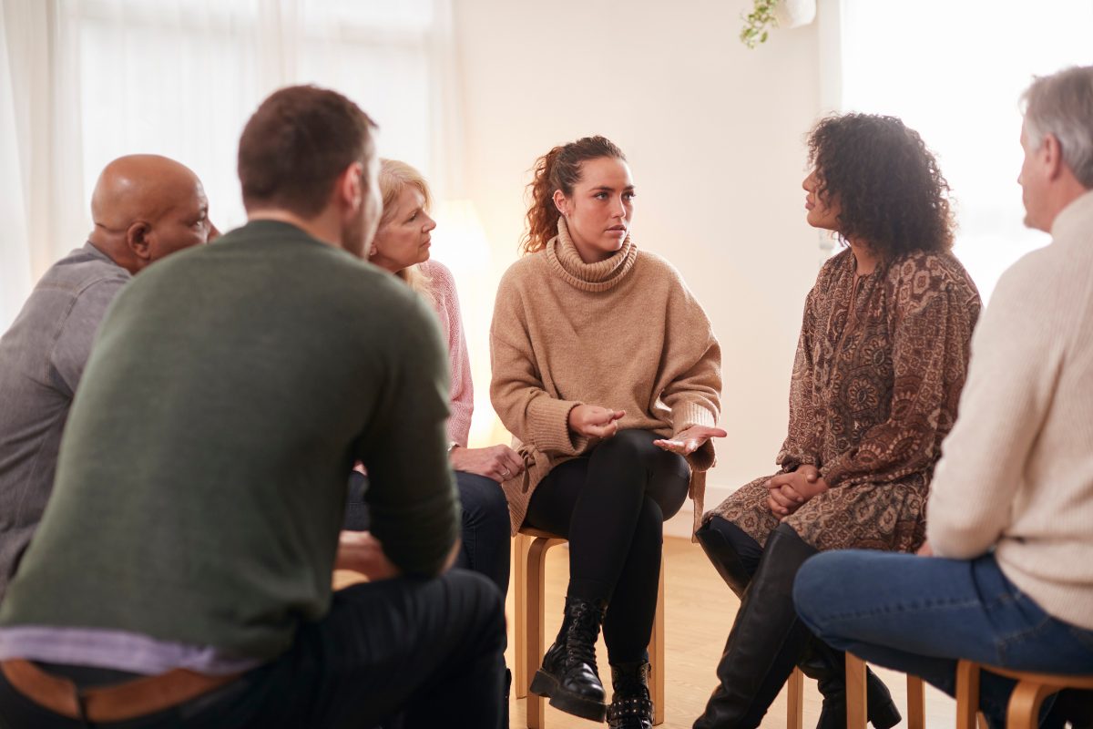 Group therapy participants discussing ground rules for the therapy group
