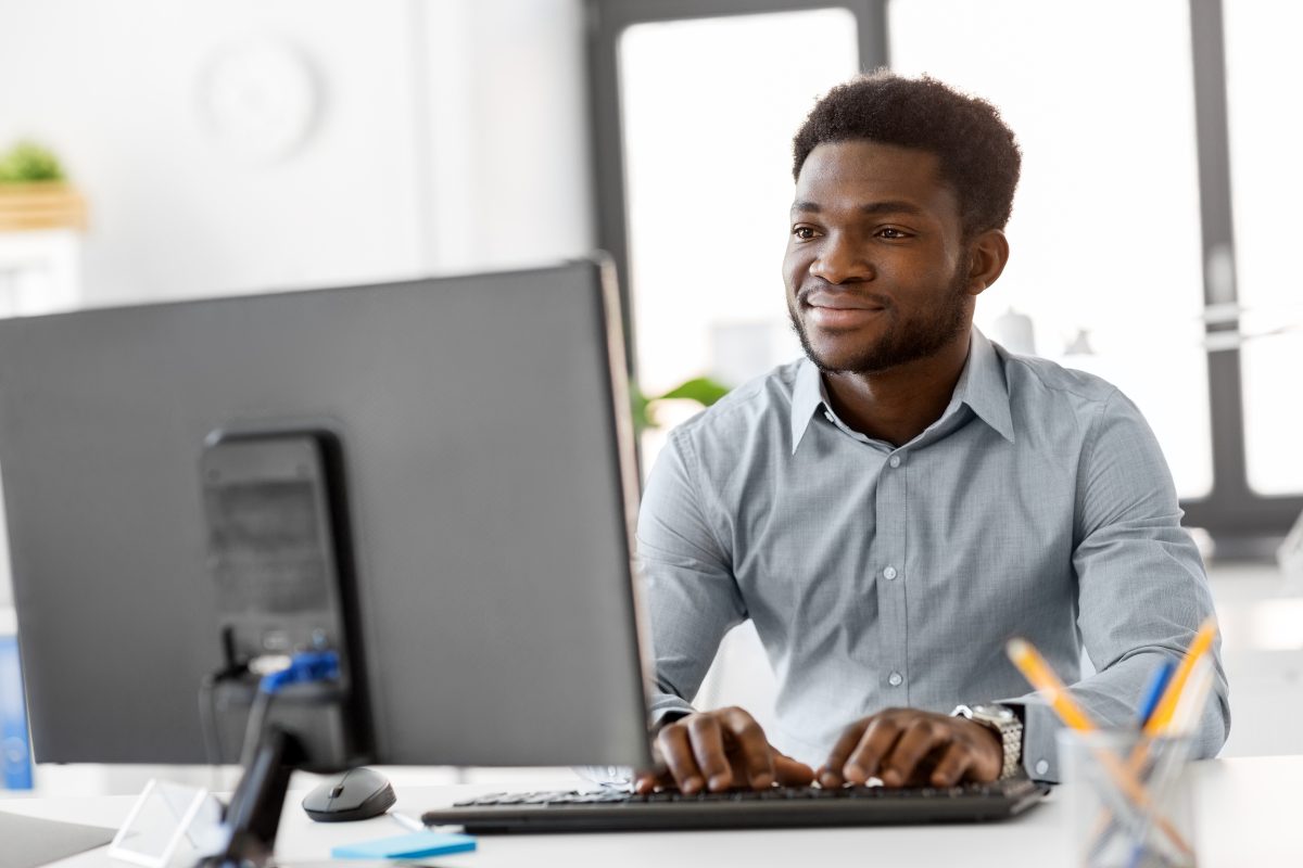 mental health provider writing a narrative note on a desktop computer